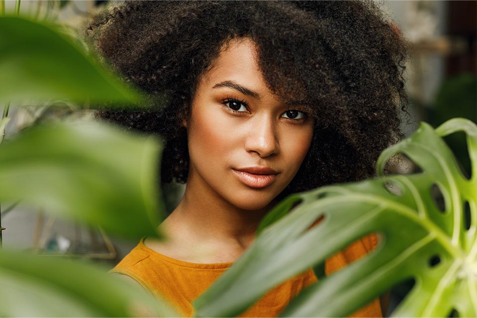 woman among green ferns