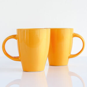 two yellow mugs with handles.